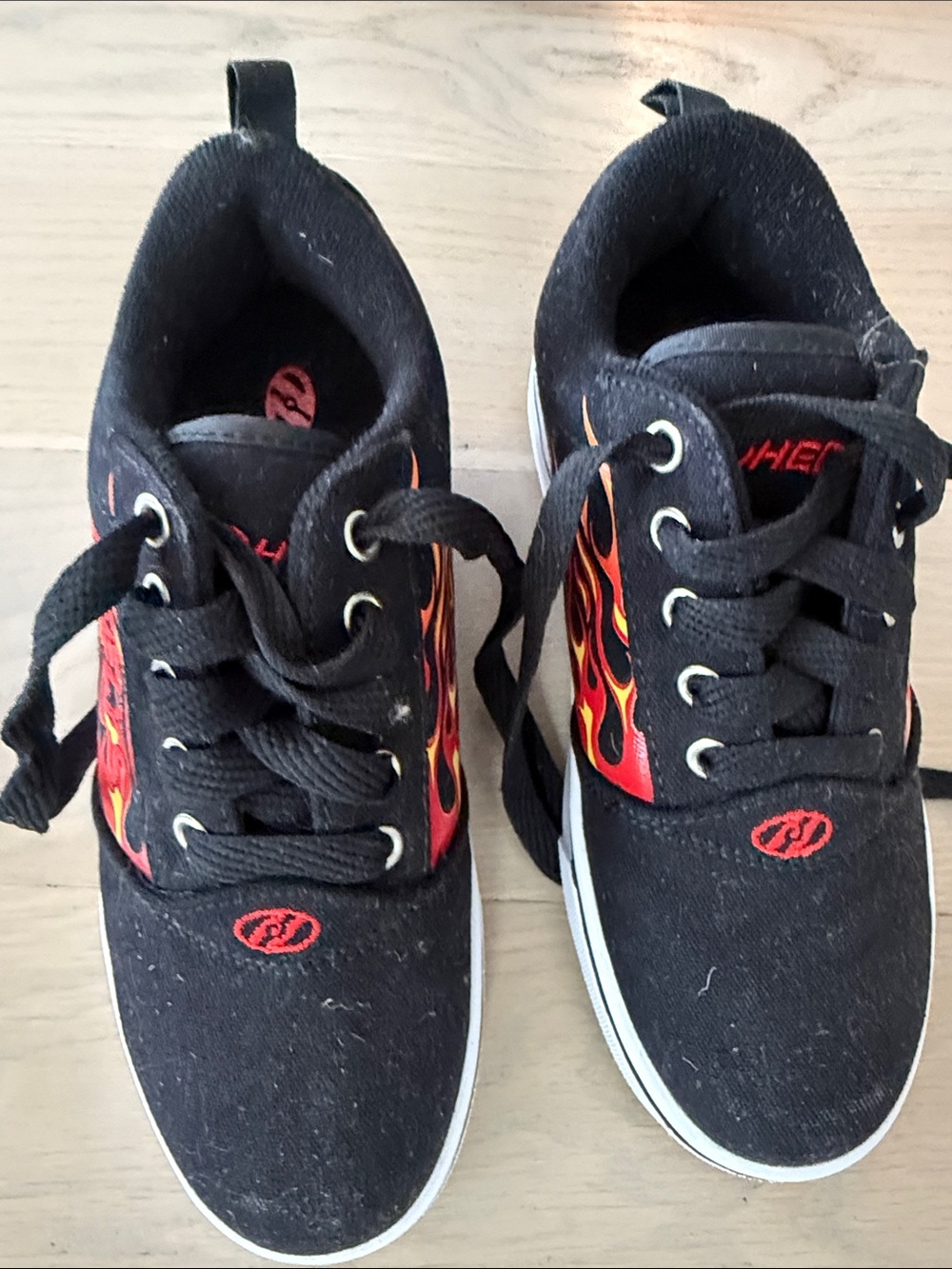 Heelys Black Kids Sneakers with Red and Orange Flame Graphic